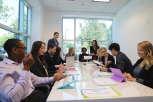 team collaborating in conference room at bright age social media agency