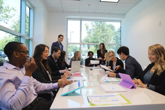 team collaborating in conference room at bright age social media agency
