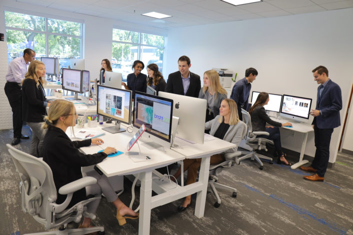 wide picture of working office at bright age social media agency