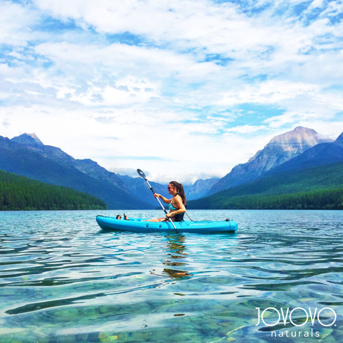 jovovo girl on kayak jovovo girl on kayak between lake and mountains