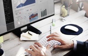 hands typing on computer doing google ads management