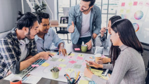 a social media agency team to show the Advantages of Using a Social Media Agency vs. Creating an In-House Team