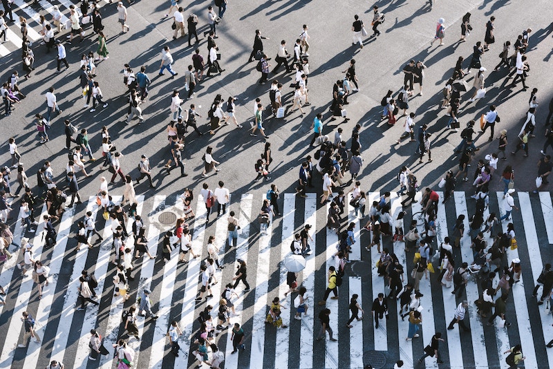 busy intersection of people crossing the street