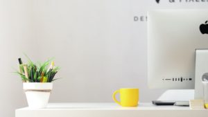 Image of office desk as a visual aid to social media management and a brand development agency