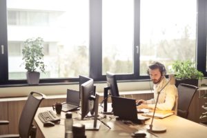 social media community management done by man with headphones