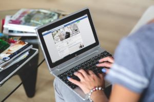 social media community management by a professional woman on laptop