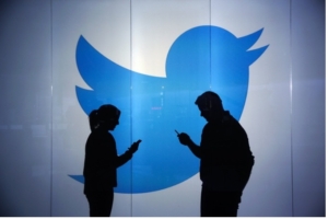 People using Twitter at social media advertising agency