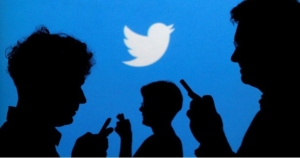 People using phones at Twitter marketing agency
