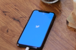 Twitter social media audience on app at table