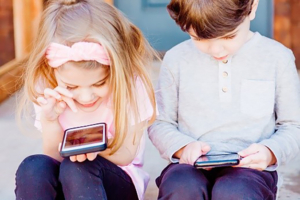 Content marketing agency to show young kids using technology.