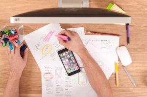 Graphic designer maps out an advertising campaign using highlighters.